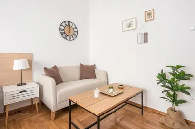 a living room with a couch and a table at Ble Elia Estia Suite in Athens