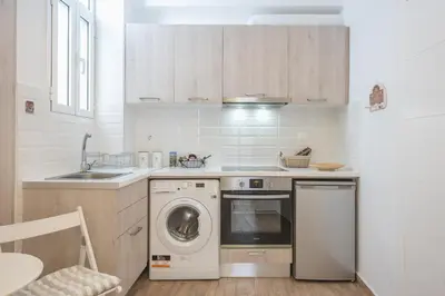 a kitchen with a washing machine and a sink at Ble Elia Parthenon Suite in Athens