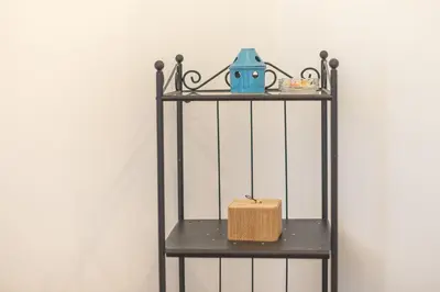 a shelf with a tea pot and a box on it at Ble Elia Parthenon Suite in Athens