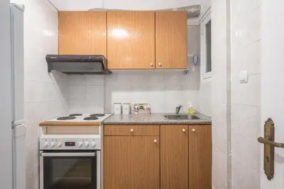 a small kitchen with a stove and a sink at Ble Elia Parthenon Suite in Athens