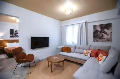 a living room with a couch and a table at Athenian Stay 302 Apartment in Athens