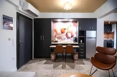 a kitchen with a large painting on the wall at Athenian Stay 302 Apartment in Athens