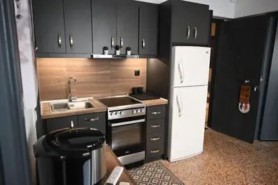 a small kitchen with a stove and a refrigerator at Athenian Stay 303 Apartment in Athens