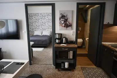 a mirror in a room with a bed and a bedroom at Athenian Stay 303 Apartment in Athens