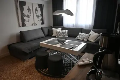 a living room with a couch and a table at Athenian Stay 303 Apartment in Athens