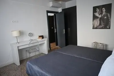 a bedroom with a bed and a desk and a picture at Athenian Stay 303 Apartment in Athens