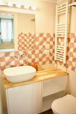a bathroom with a sink and a toilet at Cozy & Luxurious 70m2 apartment in Athens