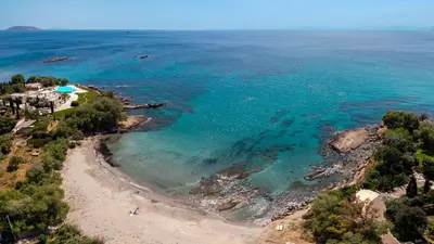 an aerial view of a beach and the ocean at Mira Seaside Residence in Kalívia Thorikoú