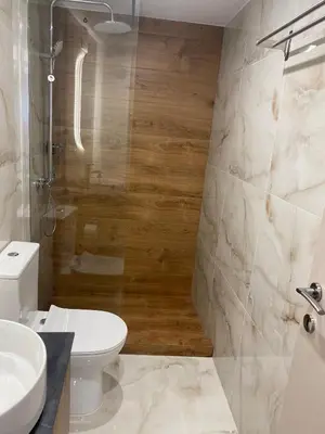 a bathroom with a toilet and a sink at Real City Suites Lekka in Athens