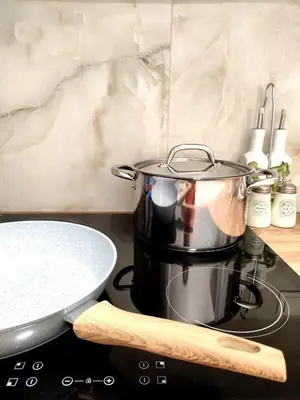 a pot on top of a stove in a kitchen at Athenian Stay Chara's Apartment in Athens