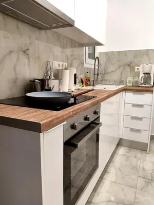 a kitchen with a counter with a sink at Athenian Stay Chara's Apartment in Athens