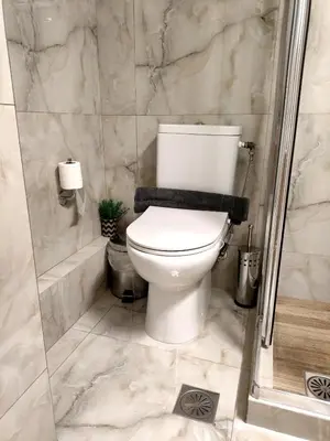 a bathroom with a toilet and a shower at Athenian Stay Chara's Apartment in Athens