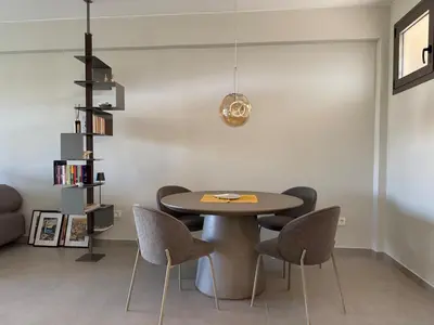 a dining room with a table and chairs at Nomadic life-Elegant Apartment by Athens Riviera in Athens
