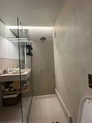 a bathroom with a shower and a sink at Nomadic life-Elegant Apartment by Athens Riviera in Athens