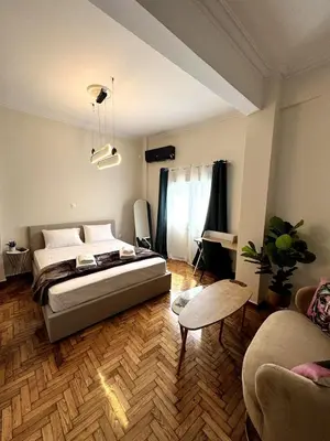 a bedroom with a bed and a living room at Athenian Stay Chara's 2 Apartment in Athens