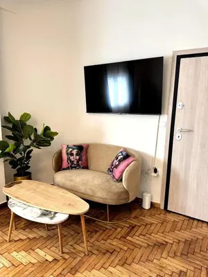 a living room with a couch and a table at Athenian Stay Chara's 2 Apartment in Athens