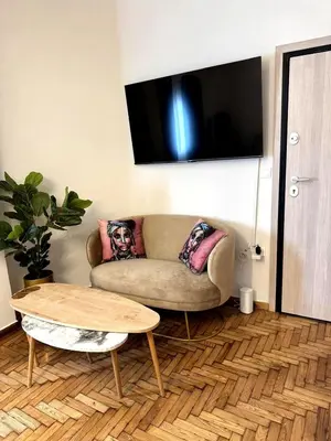 a living room with a couch and a table at Athenian Stay Chara's 2 Apartment in Athens