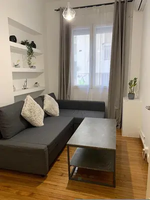 a living room with a couch and a table at Athenian Stay Kolonaki Apartment in Athens