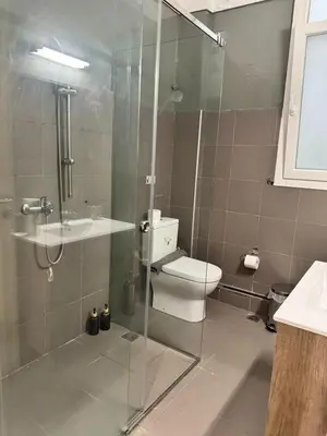 a bathroom with a shower and a toilet and a sink at Athenian Stay Kolonaki Apartment in Athens