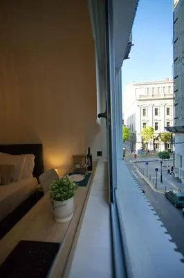 a living room with a view of a city street at Blisséa in Piraeus