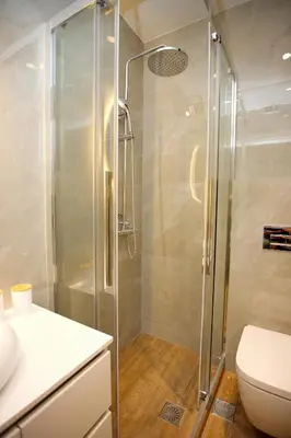 a bathroom with a shower and a toilet at Blisséa in Piraeus