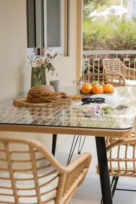 a table with a plate of oranges on it at Vouliagmeni Suite 1 by Anothr in Athens