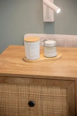 two containers sitting on top of a wooden table at Vouliagmeni Suite 1 by Anothr in Athens