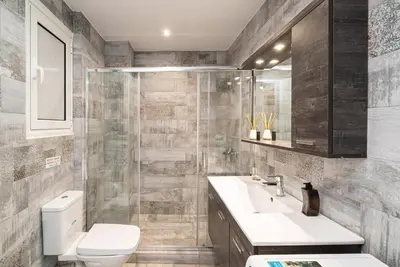 a bathroom with a toilet and a sink at Athens Casa All Acropolis in Athens