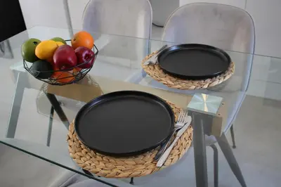 two baskets of fruit sitting on a glass table at ARIS Urban Gazi in Athens