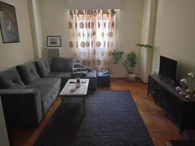 a living room with a couch and a coffee table at Stella in Athens