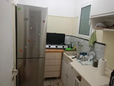 a kitchen with a stainless steel refrigerator at Stella in Athens