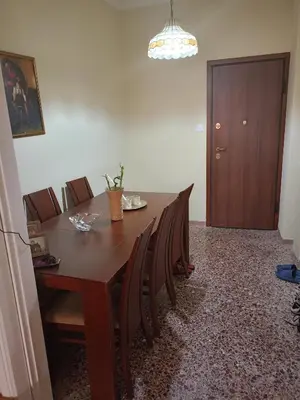 a dining room with a wooden table and chairs at Stella in Athens
