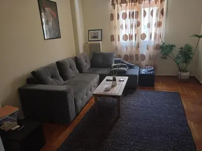 a living room with a couch and a coffee table at Stella in Athens