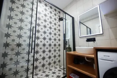 a bathroom with a shower and a sink at ARIS Ampelokipoi retreat in Athens