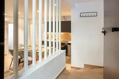 a staircase in a house with white railings at Exclusive 3-Bedroom Haven in Kolonaki Center in Athens