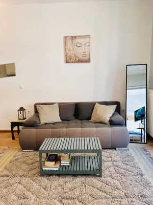 a living room with a couch and a coffee table at Urban Apartment At Monastiraki Sq - Psiri in Athens