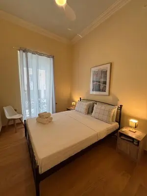 a bedroom with a large bed in a room at The Agora Residence in Athens