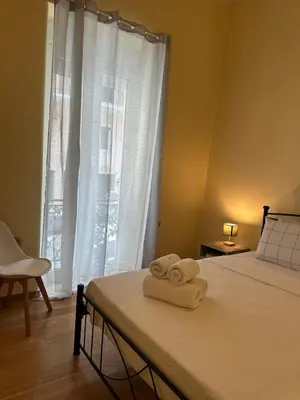 a bedroom with a bed with towels on it at The Agora Residence in Athens