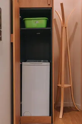 a cabinet with a green container and a box at Koukaki Zen Studio in Athens