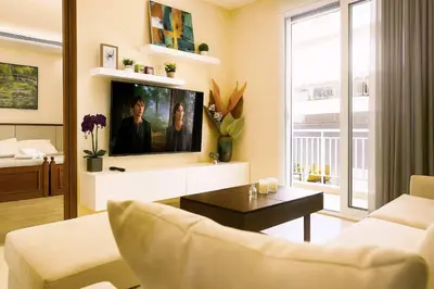 a living room with a couch and a tv at Oulang Cozy Apartment Athens- Acropolis View Haven in Athens