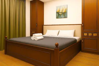 a bedroom with a bed with towels on it at Oulang Cozy Apartment Athens- Acropolis View Haven in Athens