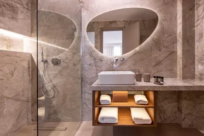a bathroom with a sink and a shower at Ermou Kaliendia Suite in Athens