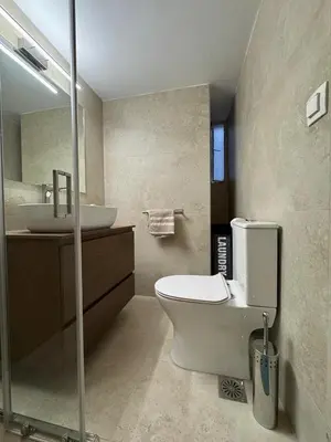 a bathroom with a toilet and a sink at Cozy & Fully renovated apartment in Athens
