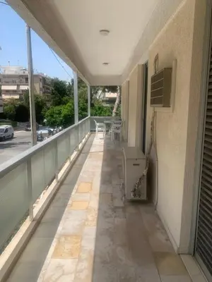 a balcony of a building with a view of a street at Παλαιό Φάληρο Αθηναϊκή Ριβιέρα in Athens