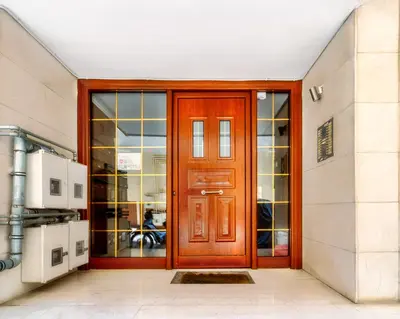 a wooden door in front of a building at Melina's Apartment Neo Psychiko in Athens