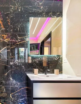 a bathroom with a sink and a mirror at Melina's Apartment Neo Psychiko in Athens