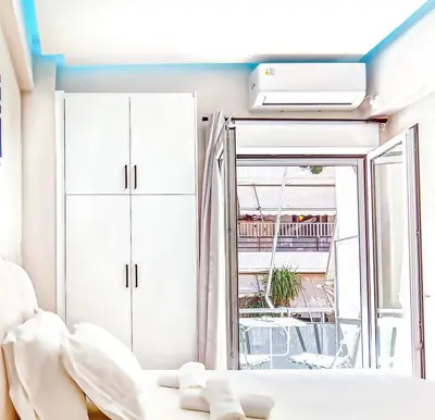 a room with a bed and a window at Melina's Apartment Neo Psychiko in Athens