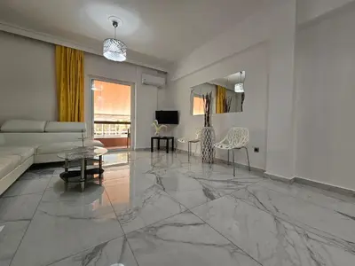 a living room with a marble floor at SantaRoza Luxury Apartment in Piraeus