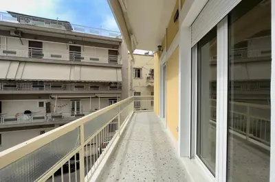 an empty balcony of an apartment building at Koukaki 2BR Apt with Balcony, Walk to Acropolis in Athens