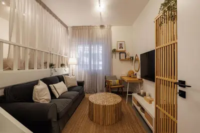 a living room with a couch and a table at Sunlit homie flat at Arrianou! in Athens